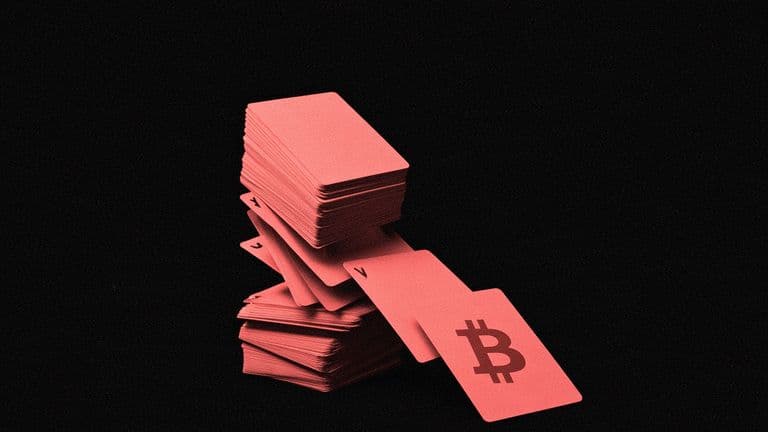 A house of playing cards collapsing in the dark, the top card with the Bitcoin mark falling toward the viewer.